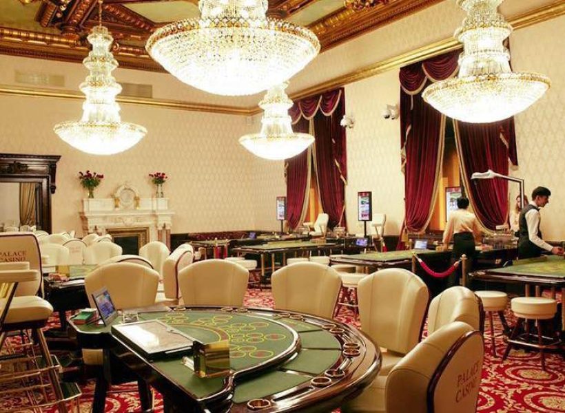 Palace Casino Elegant casino interior with luxurious chandeliers and gaming tables, creating a classy ambiance for entertainment.