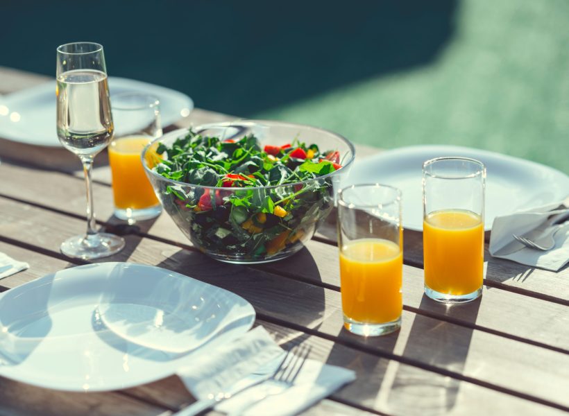 A table with a meal for a party outdoors