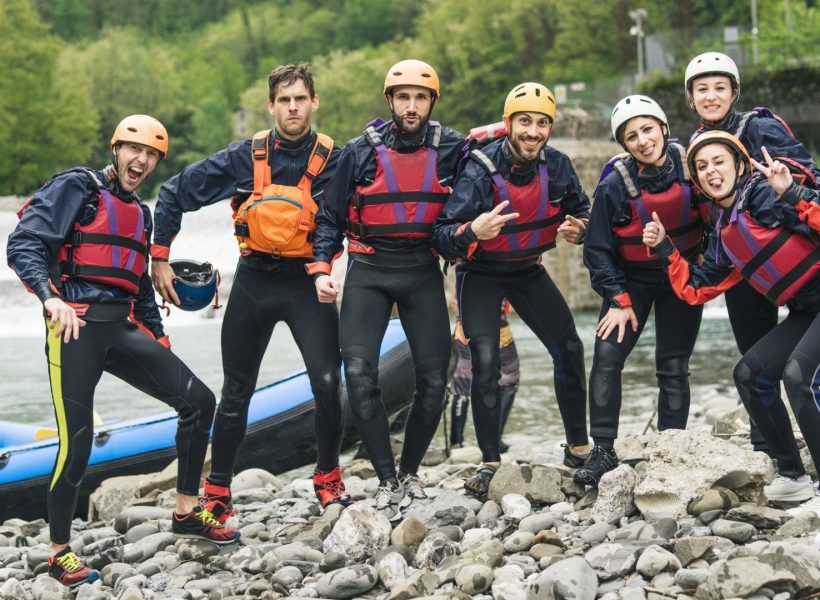 group-of-playful-friends-at-a-rafting-class-posing-at-boat-e1645648125493.jpg